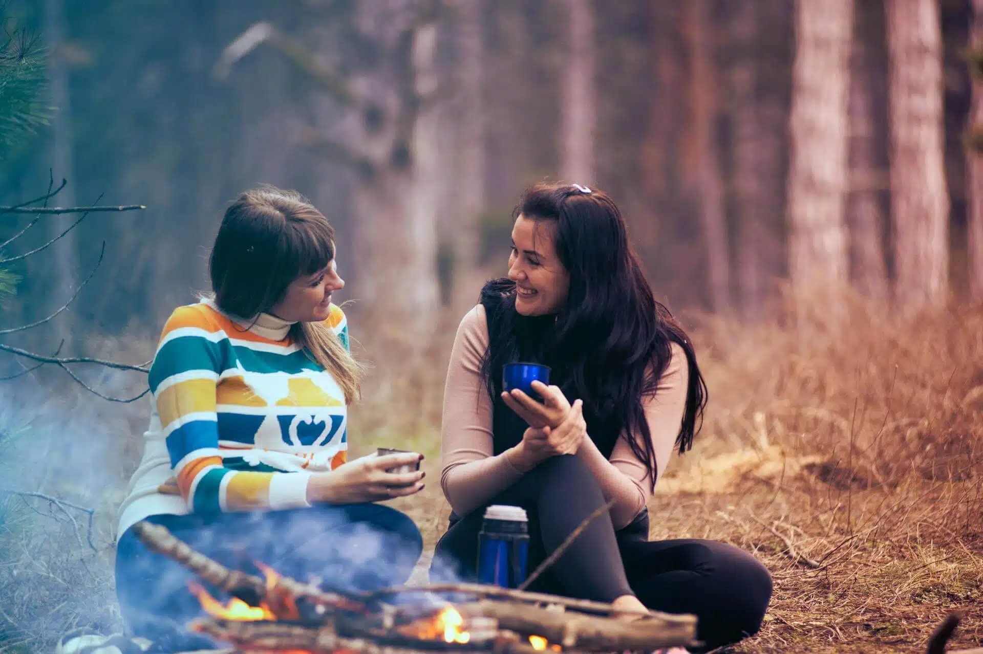 Women talking at a campsite