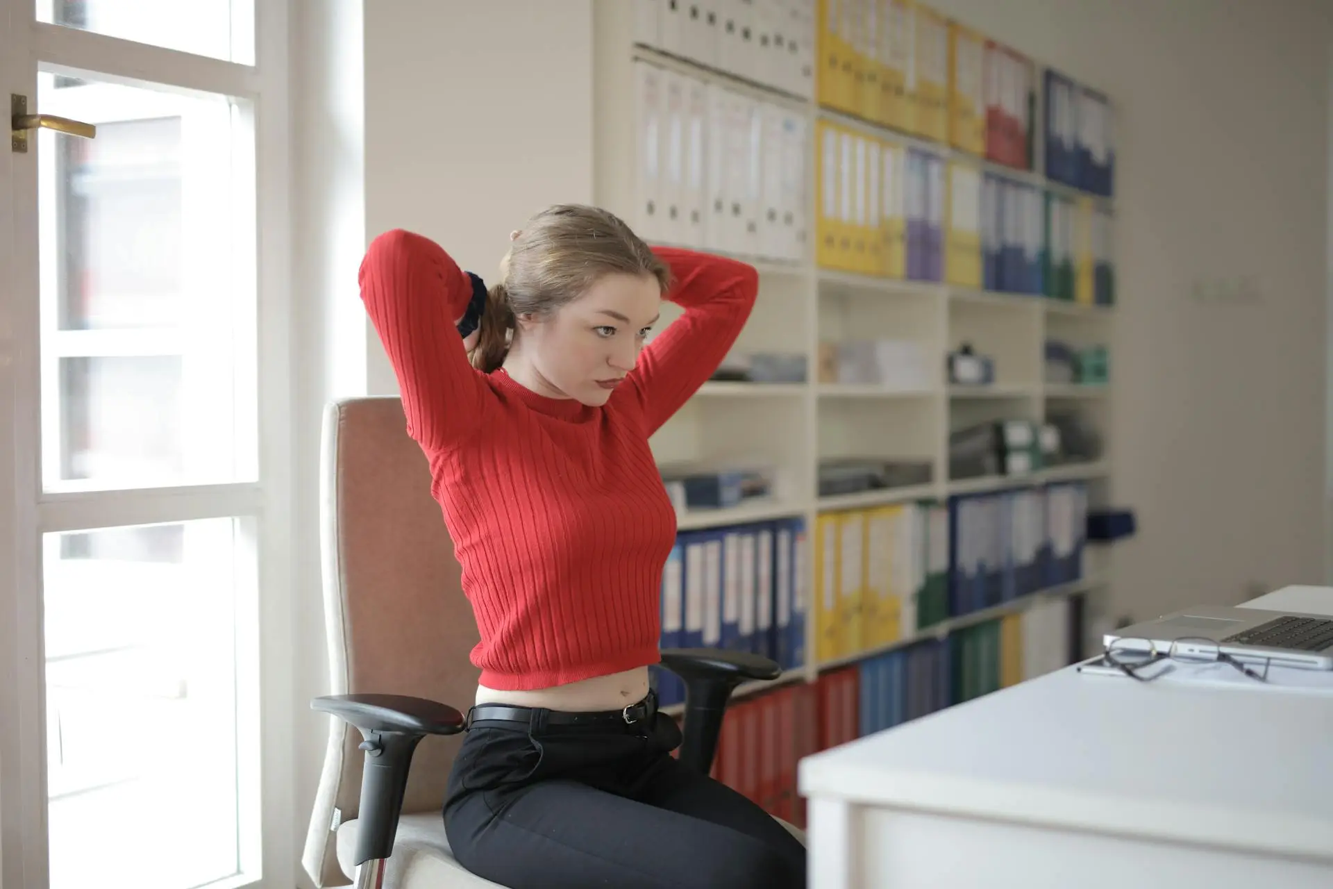 Female entrepreneur taking a break in the office - showing healthy work habits